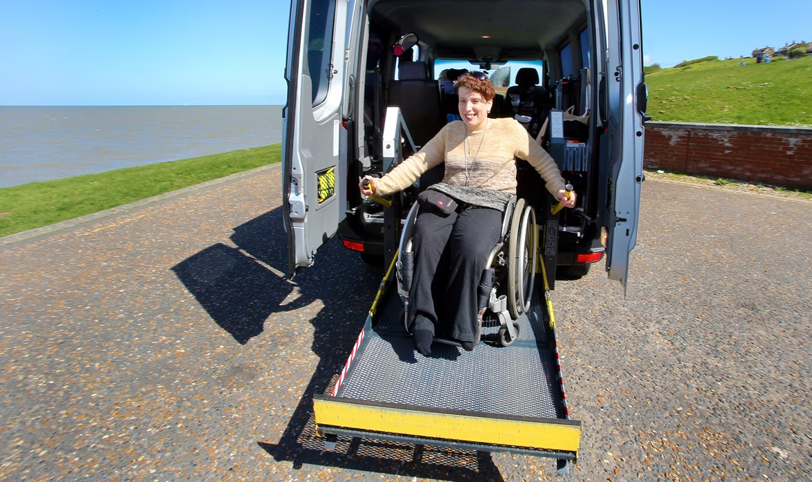Angela is looking confident and happy as she comes down the ramp of her WAV in her wheelchair